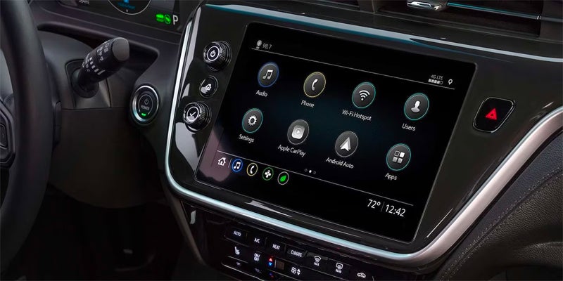 A close-up view of a car dashboard displaying various controls.