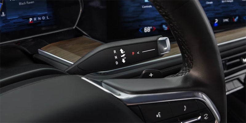 A 2026 Chevrolet Tahoe navigating a rugged dirt road