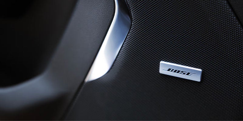 A red 2026 Chevrolet Tahoe parked on the roadside