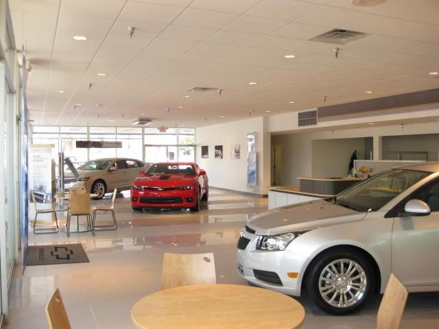 Interior view of the showroom with displayed cars
